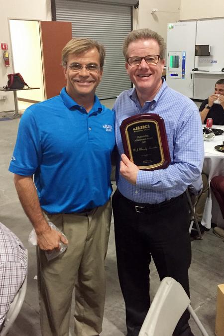 Bill Astle, President of JAS, Inc., presented the award to David Murphy at the Juki awards banquet.
